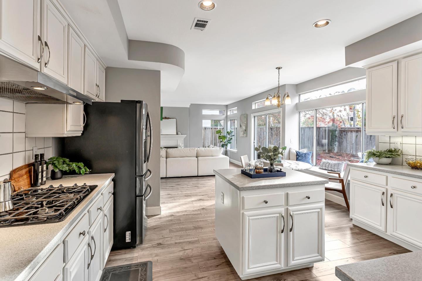 1173 Eagle Ridge Way Milpitas, CA 95035 - Photo 8 of 30 a kitchen with stainless steel appliances granite countertop a sink stove and refrigerator