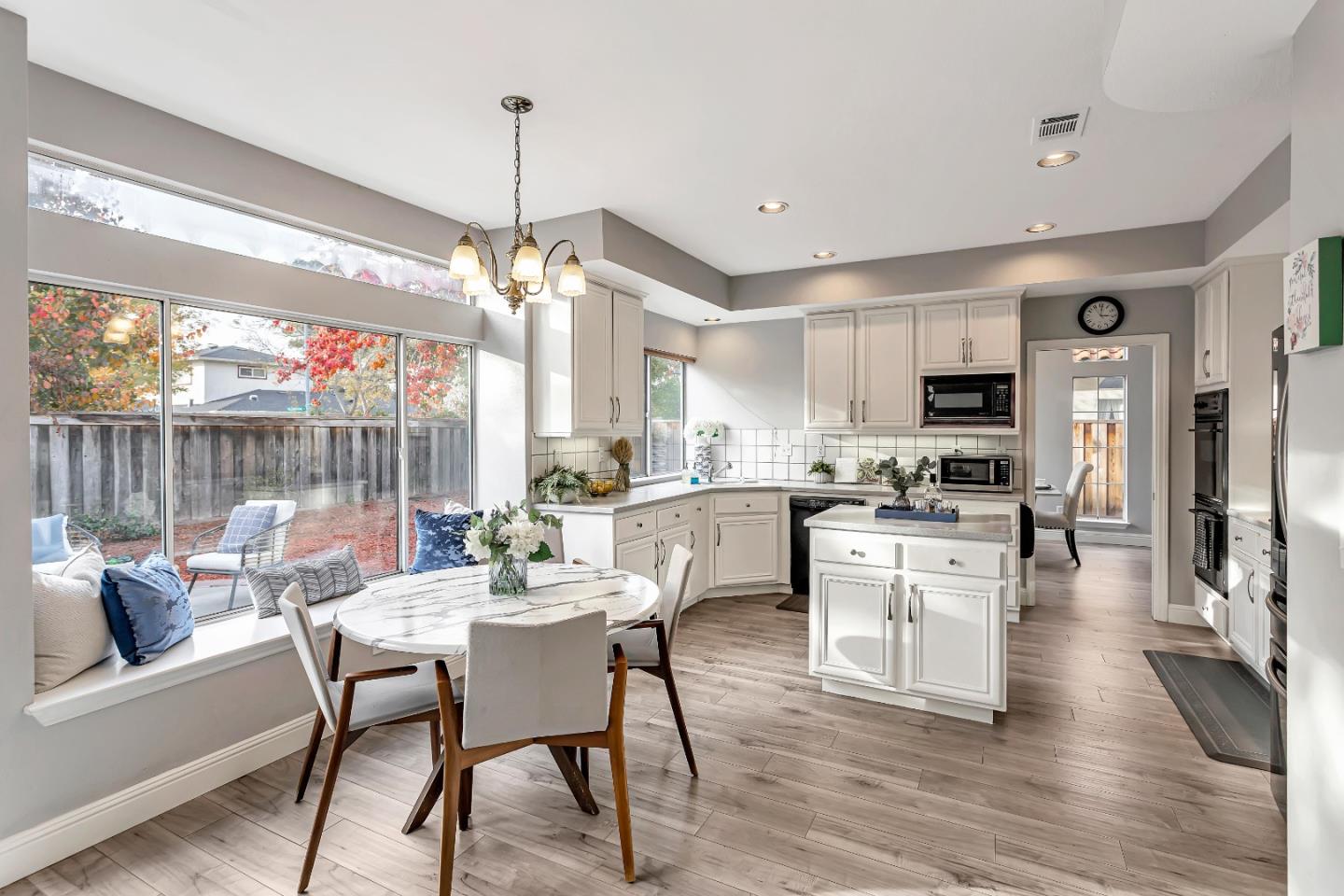 1173 Eagle Ridge Way Milpitas, CA 95035 - Photo 9 of 30 a dining room with furniture a chandelier and wooden floor