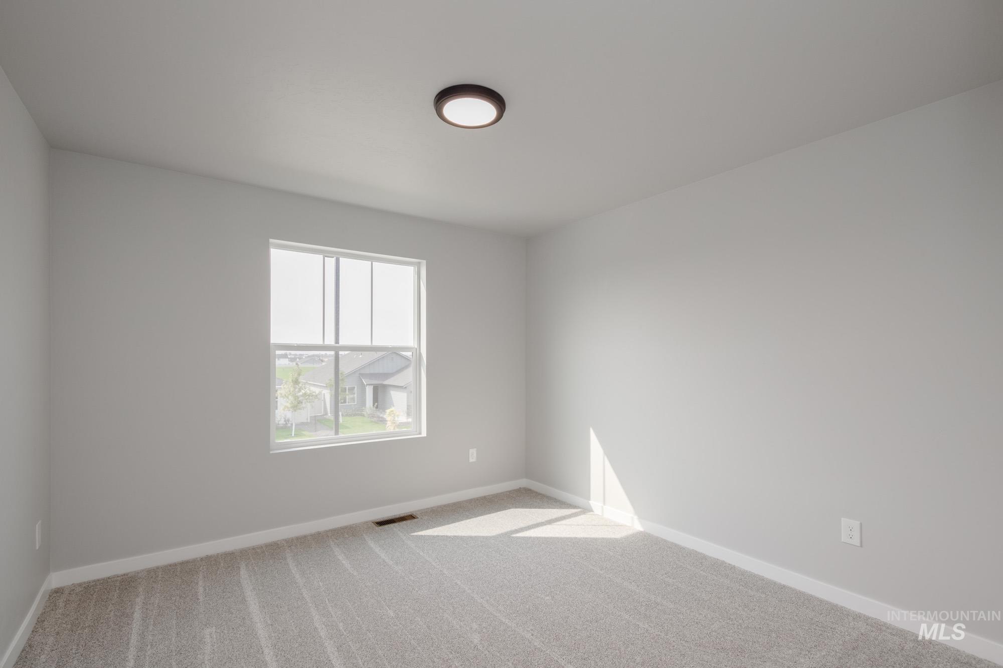 3304 West Morere Drive Meridian, ID 83642 - Photo 21 of 28 Unfurnished room with carpet floors and baseboards