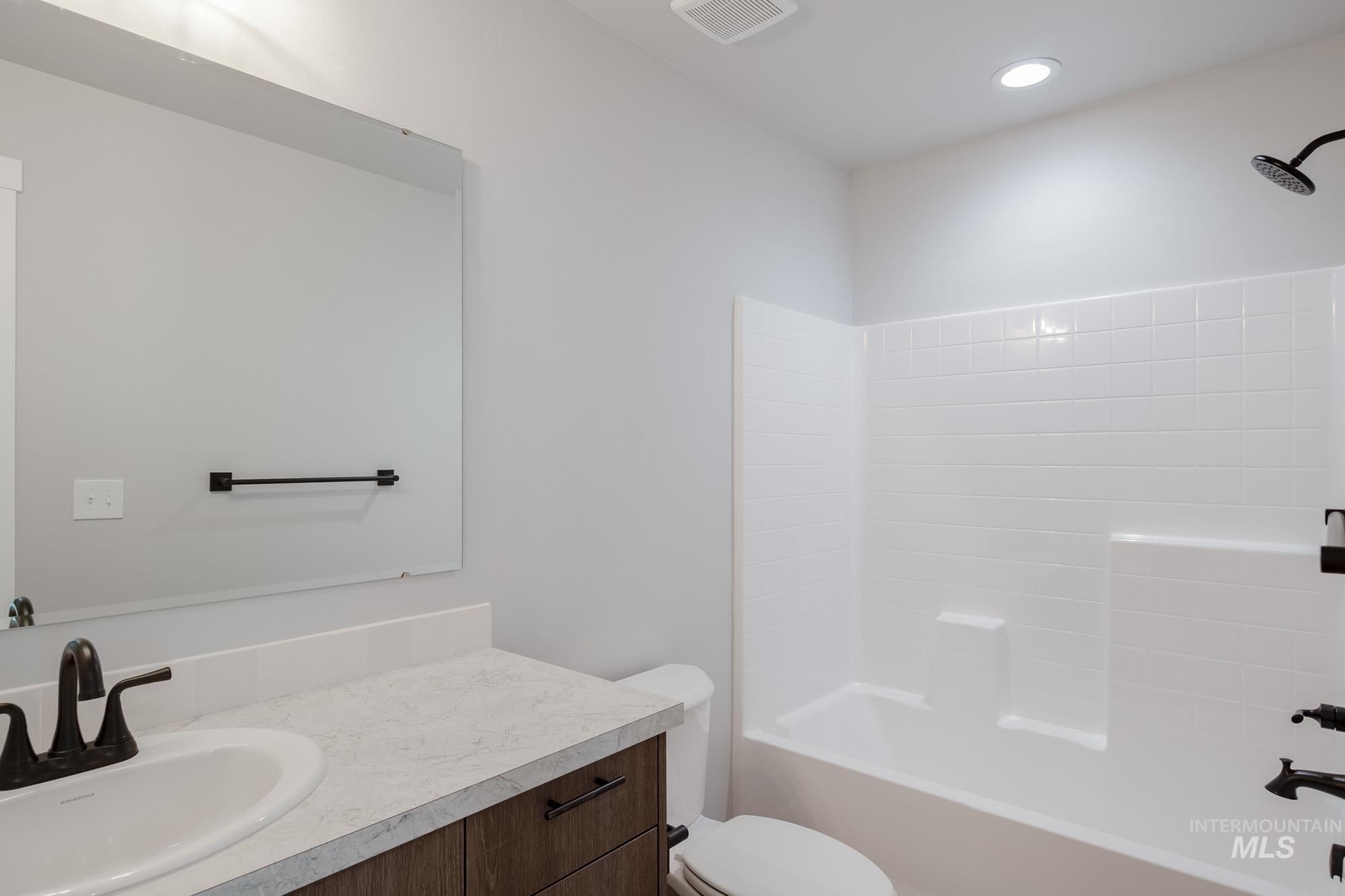 3304 West Morere Drive Meridian, ID 83642 - Photo 26 of 28 Bathroom featuring vanity and shower combination