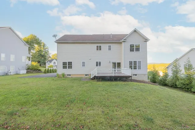 a view of a house with a backyard