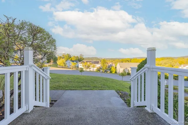 a view of a street with a yard