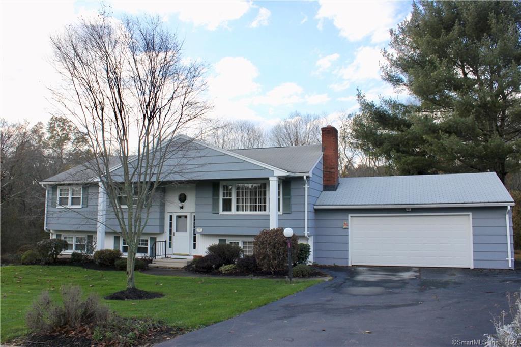 23 Rolling Ridge Road Hamden, CT 06518 - Photo 1 of 1 a front view of a house with garden