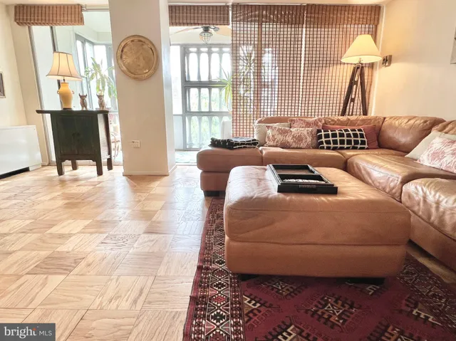 a living room with furniture and a window