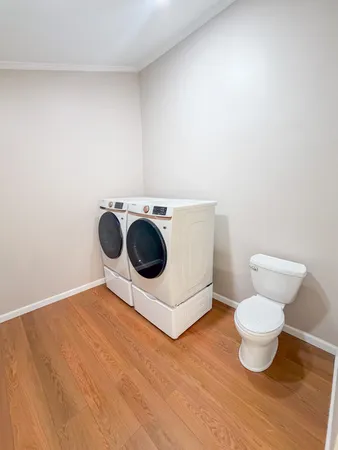 a bathroom with a toilet and a mirror