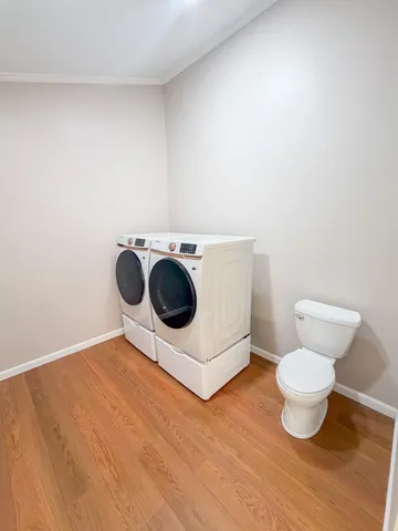 a bathroom with a toilet and a mirror