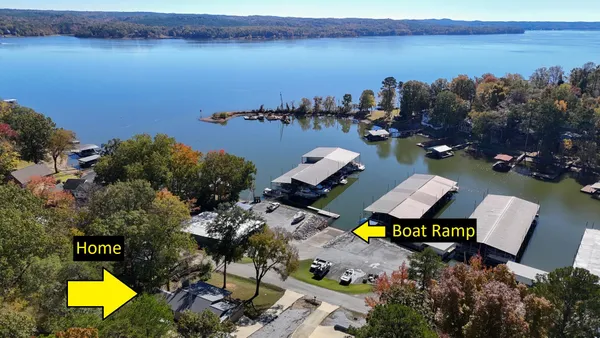 an aerial view of a house with swimming pool and outdoor space