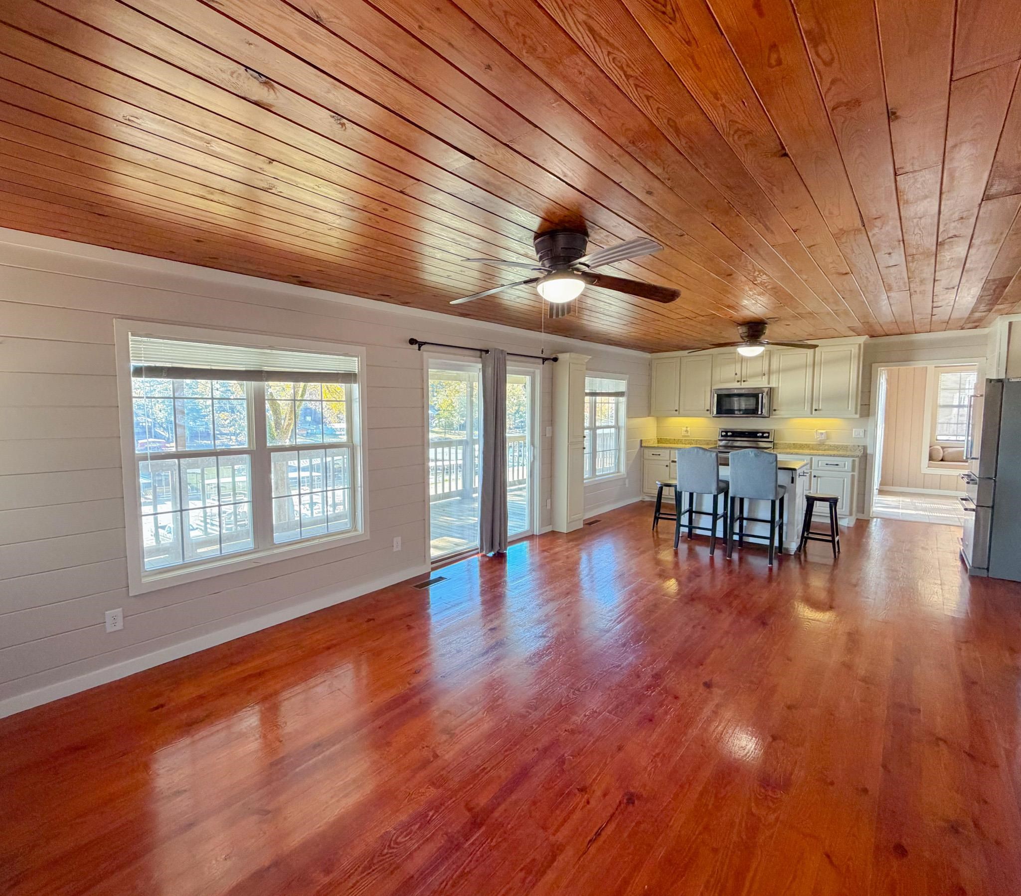 905 Cr 956 Road Iuka, MS 38852 - Photo 5 of 16 an empty room with wooden floor and dining room