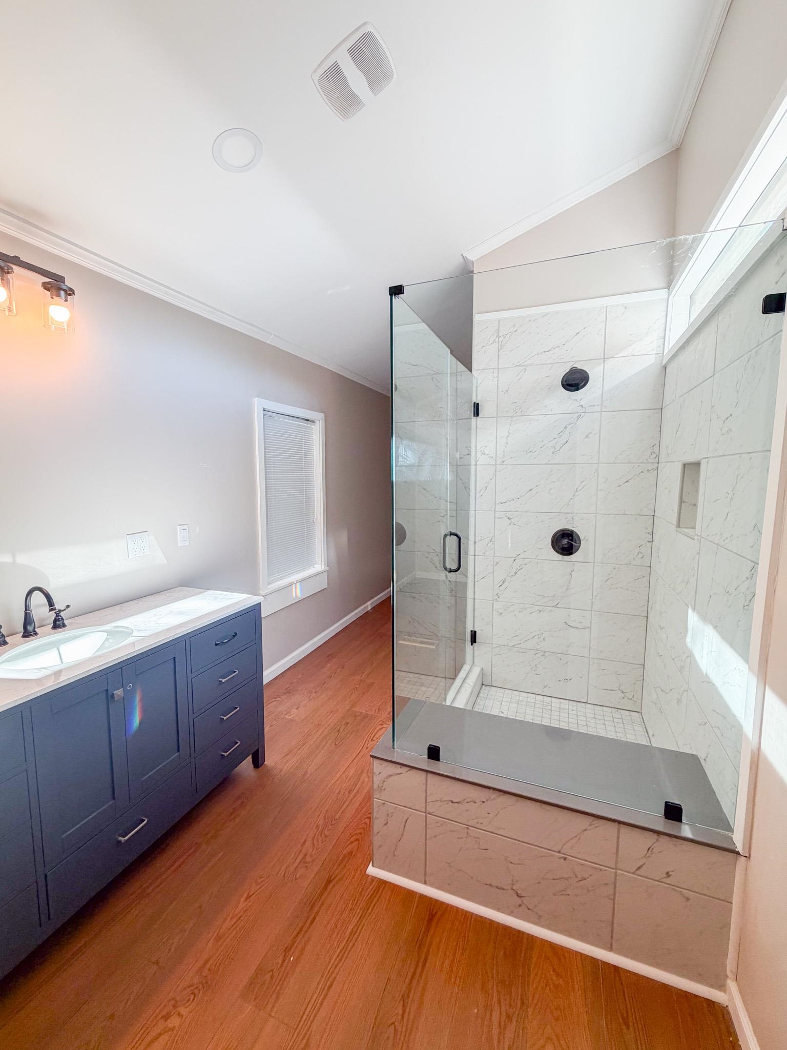 905 Cr 956 Road Iuka, MS 38852 - Photo 10 of 16 a bathroom with a tub shower vanity and sink