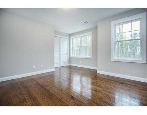 10 Old Cart Path Norfolk, MA 02056 - Photo 18 of 23 a view of an empty room with wooden floor and a window