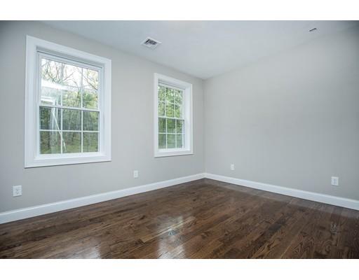 10 Old Cart Path Norfolk, MA 02056 - Photo 19 of 23 an empty room with wooden floor and windows