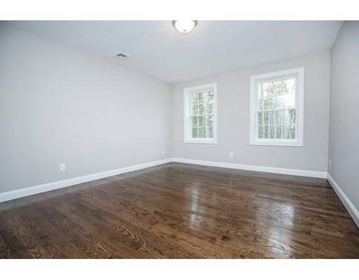 10 Old Cart Path Norfolk, MA 02056 - Photo 20 of 23 an empty room with wooden floor and windows