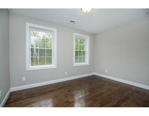 10 Old Cart Path Norfolk, MA 02056 - Photo 21 of 23 an empty room with wooden floor and windows