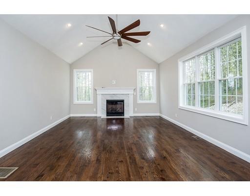 10 Old Cart Path Norfolk, MA 02056 - Photo 22 of 23 a view of empty room with wooden floor and fan
