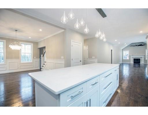 10 Old Cart Path Norfolk, MA 02056 - Photo 5 of 23 a bathroom with a sink a large mirror and vanity