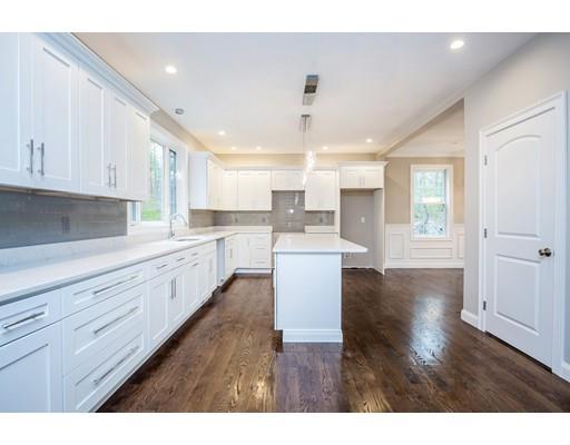 10 Old Cart Path Norfolk, MA 02056 - Photo 6 of 23 a large white kitchen with lots of counter space wooden cabinets and stainless steel appliances