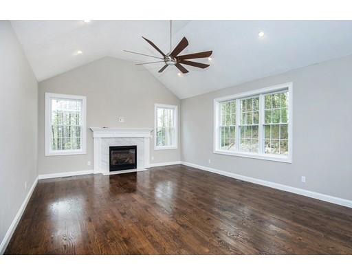 10 Old Cart Path Norfolk, MA 02056 - Photo 8 of 23 a view of empty room with wooden floor and fan