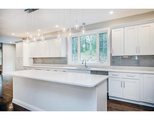 10 Old Cart Path Norfolk, MA 02056 - Photo 9 of 23 a kitchen with a sink window and cabinets
