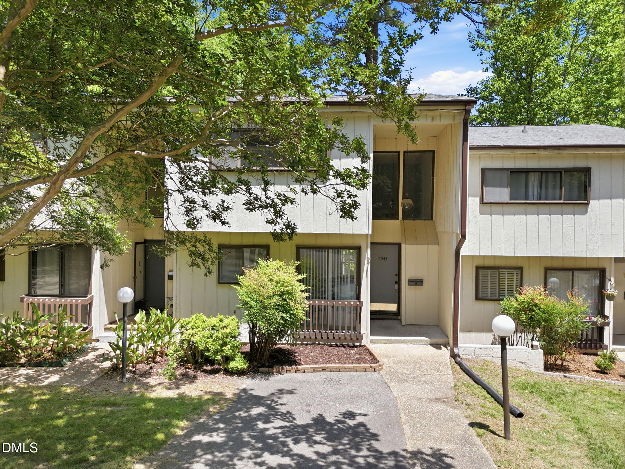 5043 Tall Pines Court Raleigh, NC 27609 - Photo 1 of 37 a front view of a house with a garden
