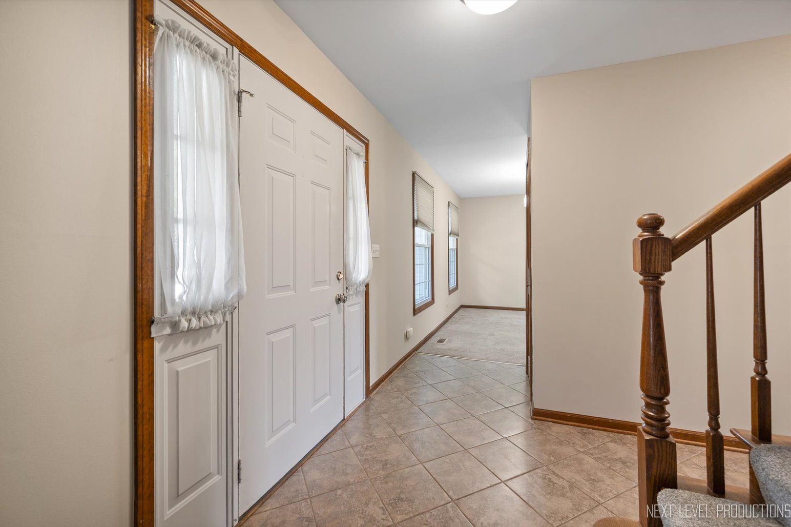 231 North Cambridge Drive Geneva, IL 60134 - Photo 18 of 34 a view of a hallway with a door
