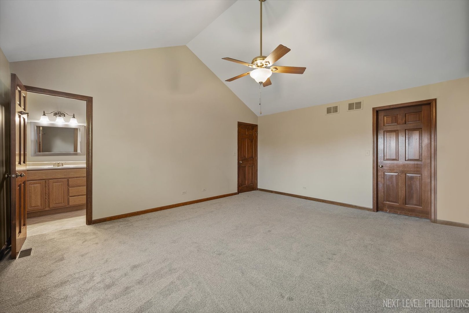 231 North Cambridge Drive Geneva, IL 60134 - Photo 21 of 34 an empty room with chandelier fan and windows