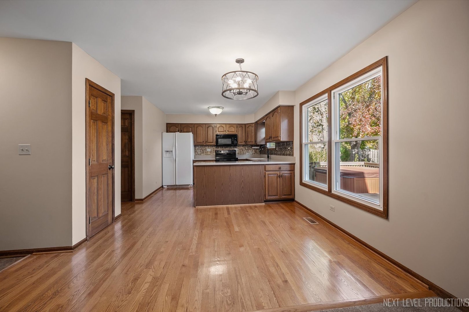 231 North Cambridge Drive Geneva, IL 60134 - Photo 7 of 34 a view of a kitchen with a sink cabinets and a window