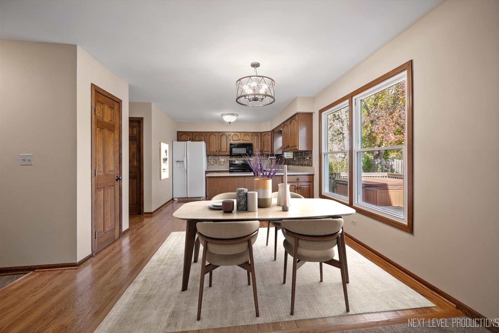 231 North Cambridge Drive Geneva, IL 60134 - Photo 8 of 34 a view of a dining room with furniture window and wooden floor