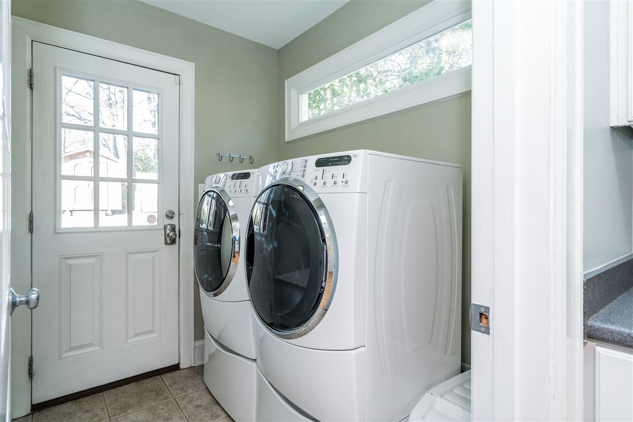 1511 Cherokee Drive Raleigh, NC 27608 - Photo 18 of 30 Laundry room was added in 2007 and is right off the kitchen! Washer and dryer stay! Laundry Room