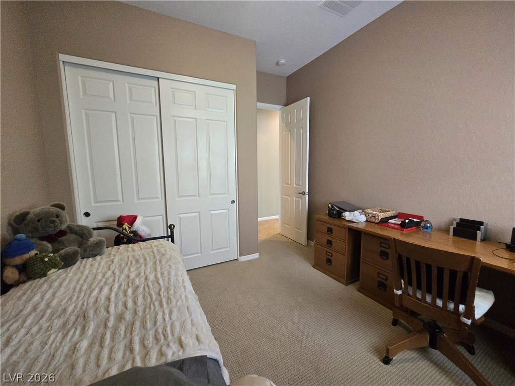2567 Dirleton Place Henderson, NV 89044 - Photo 43 of 67 Guest Bedroom Main House. A versatile room with ample storage and a dedicated workspace for productivity.