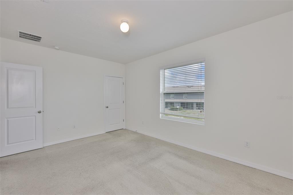 8969 Indigo Trail Loop Riverview, FL 33578 - Photo 24 of 41 a view of an empty room with a window