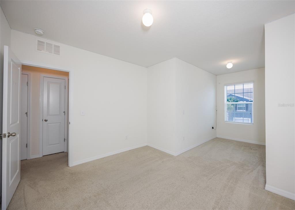 8969 Indigo Trail Loop Riverview, FL 33578 - Photo 32 of 41 an empty room with windows