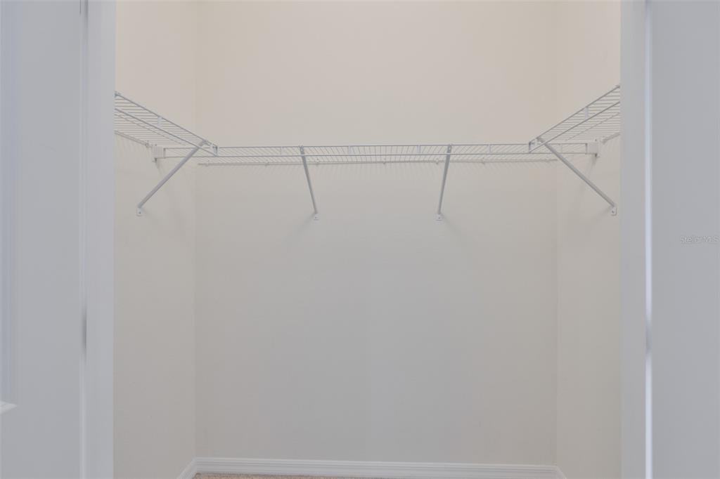 8969 Indigo Trail Loop Riverview, FL 33578 - Photo 34 of 41 a view of a room with racks on the wall