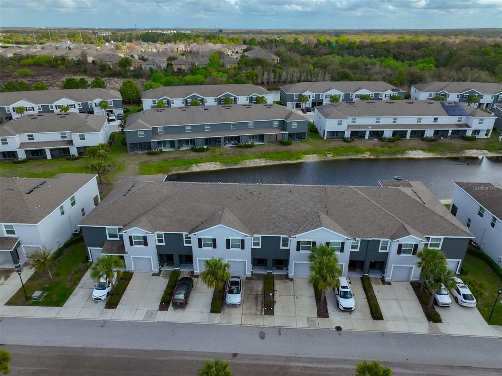 8969 Indigo Trail Loop Riverview, FL 33578 - Photo 38 of 41 an aerial view of residential houses with outdoor space and river