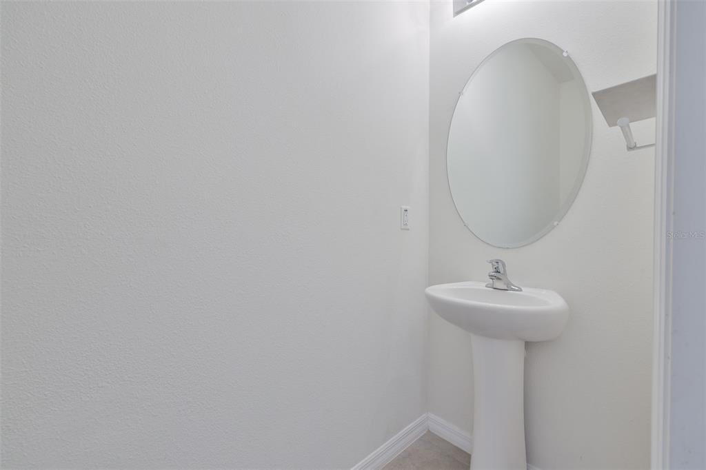 8969 Indigo Trail Loop Riverview, FL 33578 - Photo 6 of 41 a bathroom with a sink and mirror