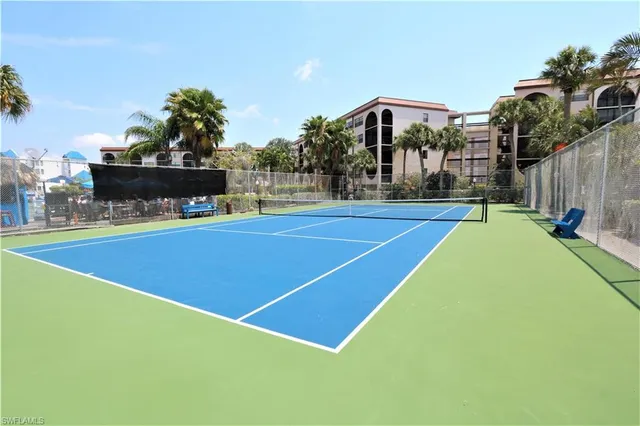 a swimming pool with outdoor seating and city view
