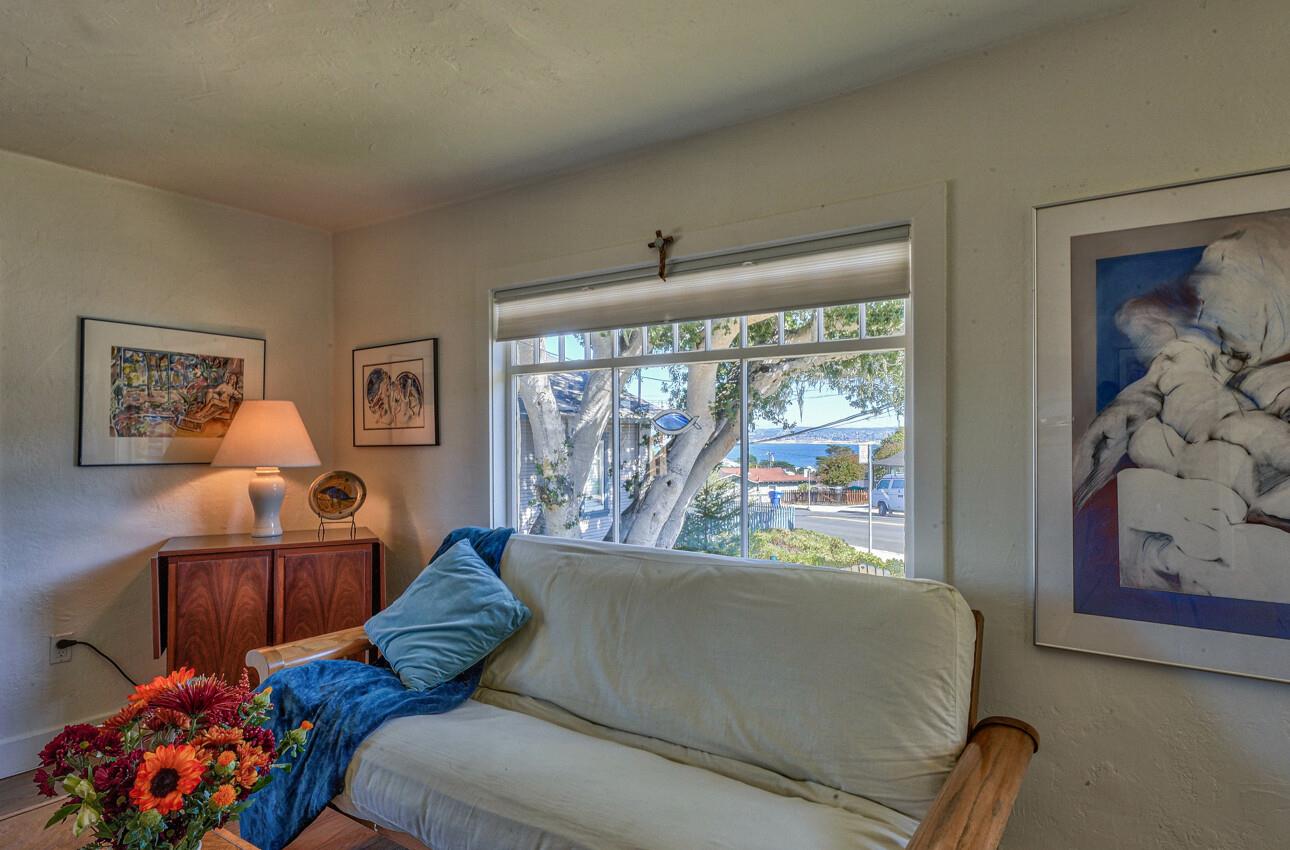 324 Eardley Avenue Pacific Grove, CA 93950 - Photo 8 of 29 a living room with furniture and a large window