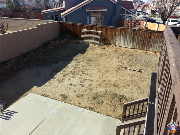 37033 Boxleaf Road Palmdale, CA 93550 - Photo 8 of 15 a view of balcony with wooden floor and fence