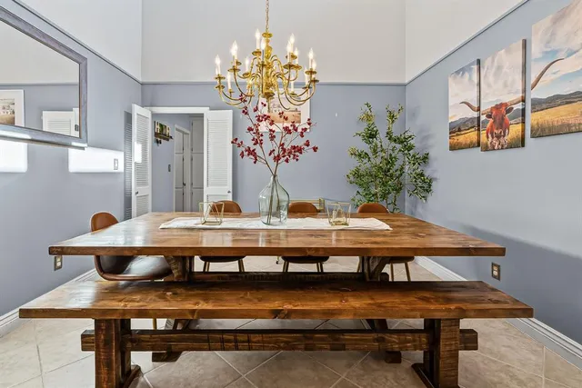 a view of room with furniture and chandelier