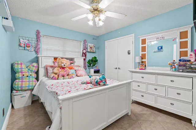 a bedroom with a bed and a dresser in it