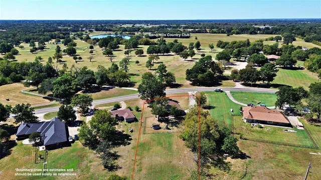 an aerial view of residential house with outdoor space