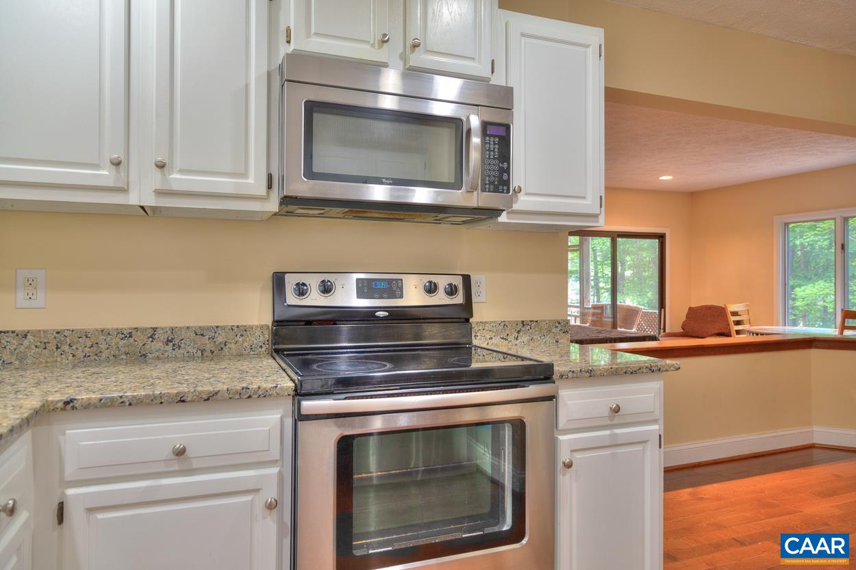 7 Stonewall Road Palmyra, VA 22963 - Photo 12 of 55 a kitchen with granite countertop white cabinets stainless steel appliances and a sink