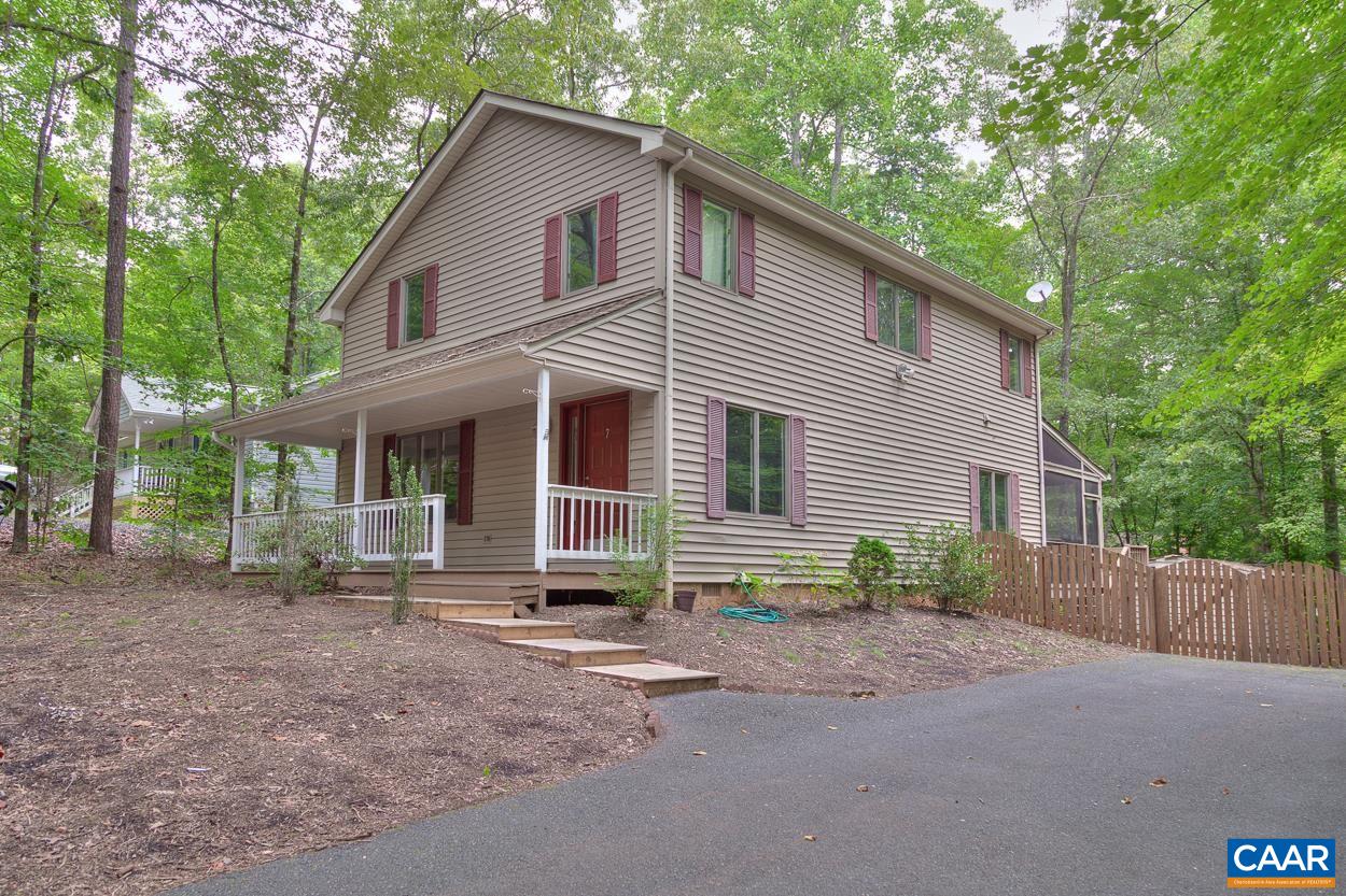 7 Stonewall Road Palmyra, VA 22963 - Photo 2 of 55 a front view of a house with a yard and garage