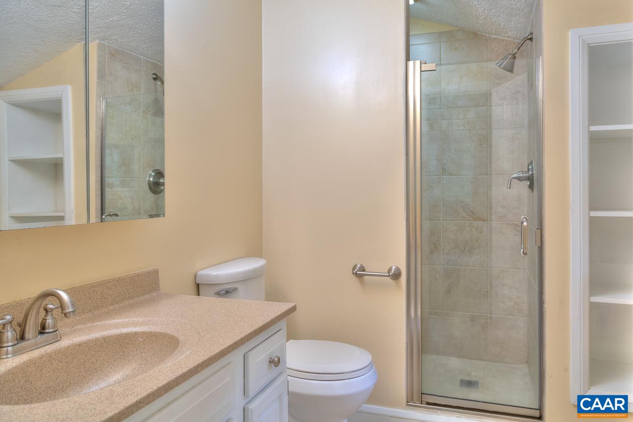 7 Stonewall Road Palmyra, VA 22963 - Photo 26 of 55 a bathroom with a sink toilet vanity and shower