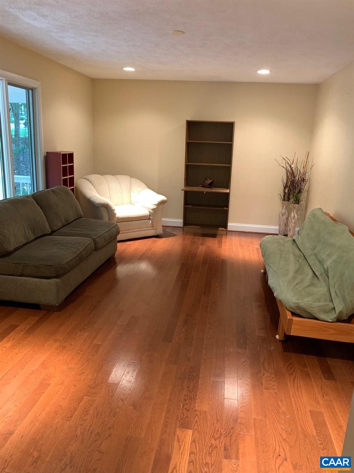 7 Stonewall Road Palmyra, VA 22963 - Photo 8 of 55 a living room with furniture and a flat screen tv