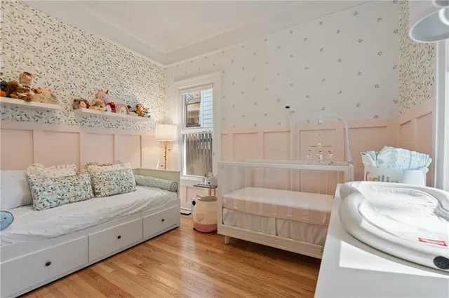 a view of a kitchen with wooden cabinet and a window