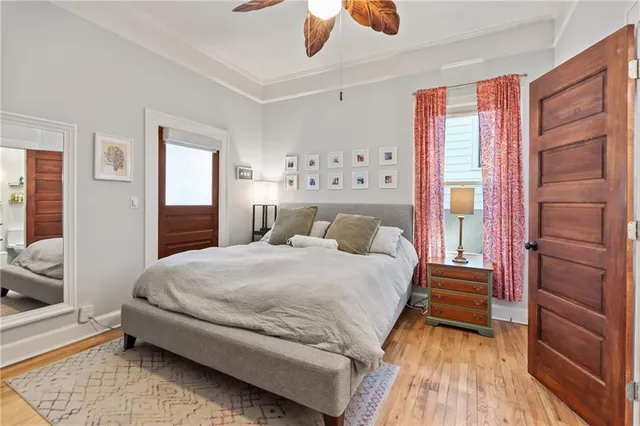 a bedroom with a bed and a flat screen tv in it