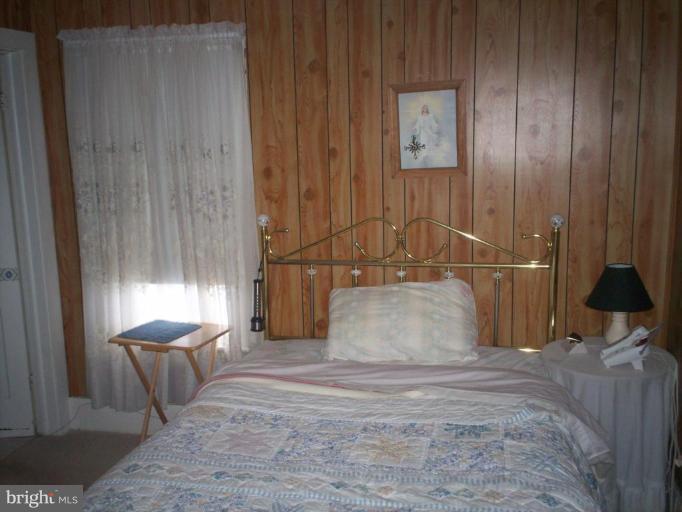 2195 Clary Road Strasburg, VA 22657 - Photo 7 of 8 a bedroom with a bed and window