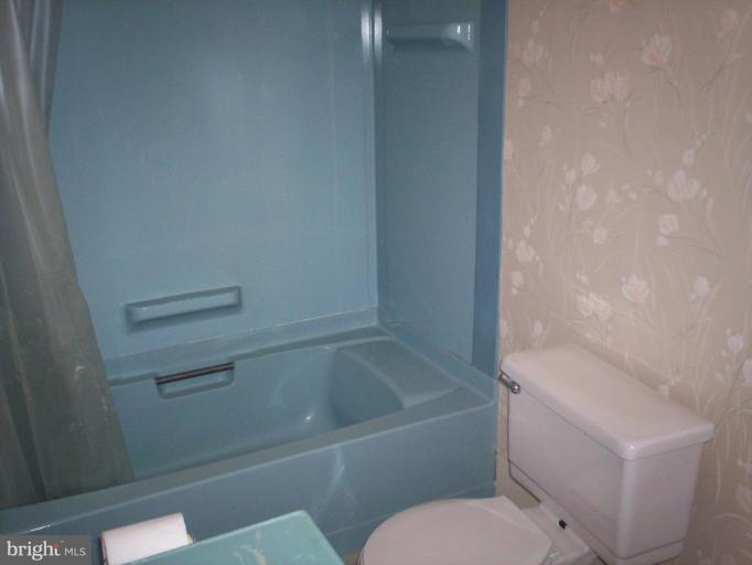 2195 Clary Road Strasburg, VA 22657 - Photo 8 of 8 a bathroom with a toilet and bathtub