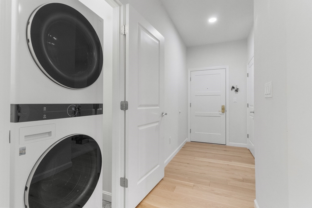 60 Coppersmith Way, Unit 304 Canton, MA 02021 - Photo 20 of 42 a view of a hallway with washer and dryer
