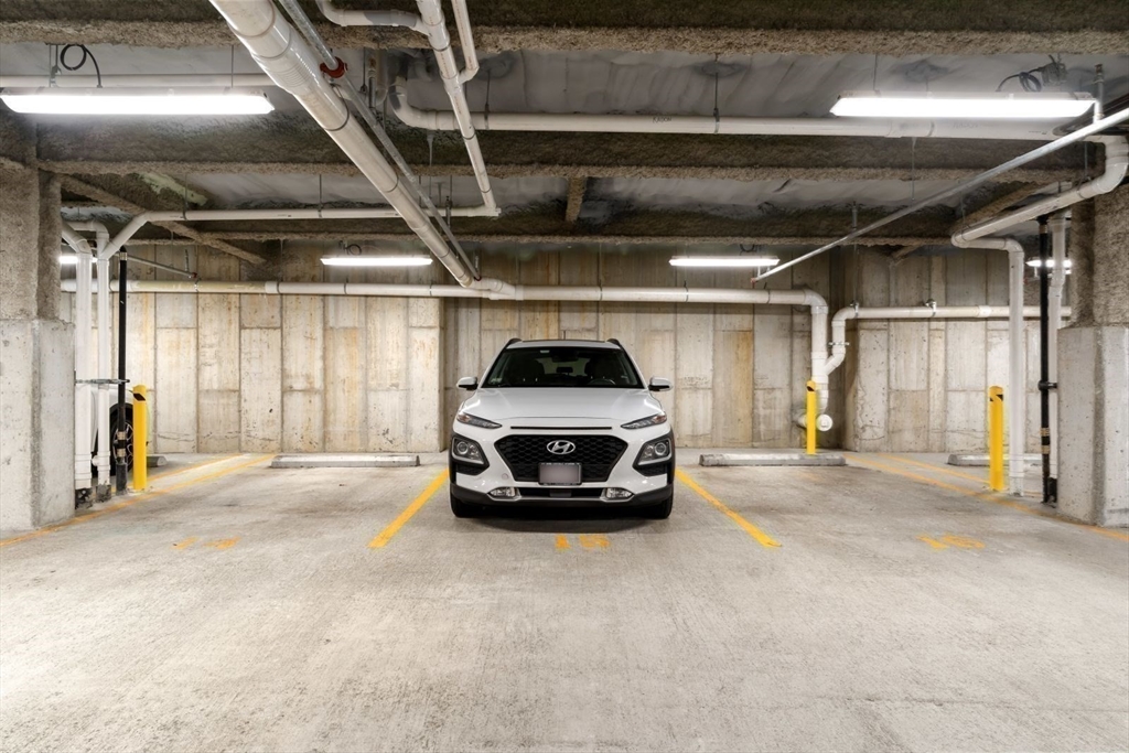 60 Coppersmith Way, Unit 304 Canton, MA 02021 - Photo 22 of 42 a car parked in a garage